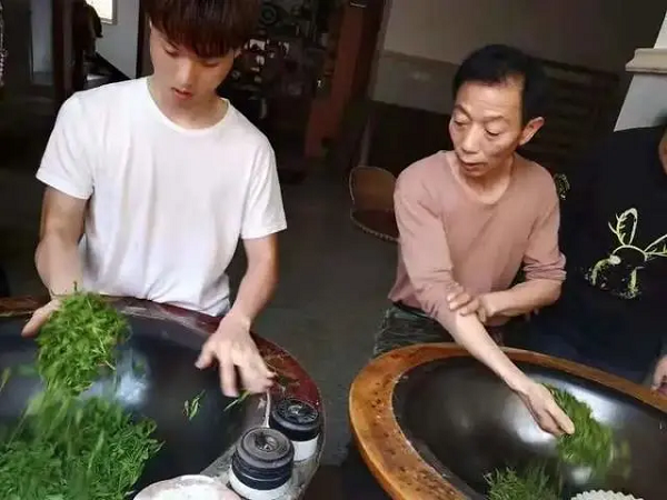 post-2000s hand-fried tea maker in hangzhou's tea village