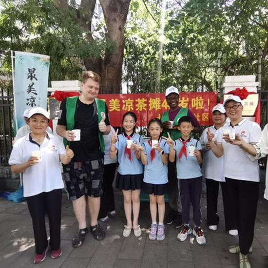 volunteers keep famed hangzhou herbal tea stall in service